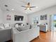 Spacious living room featuring hardwood floors, recessed lighting, and comfortable seating arrangement at 4805 Holdsworth Dr, Land O Lakes, FL 34639