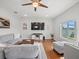 Bright living room featuring hardwood floors, recessed lighting, and comfortable seating at 4805 Holdsworth Dr, Land O Lakes, FL 34639