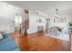 Spacious living area with hardwood floors, adjacent to the dining room and staircase at 4805 Holdsworth Dr, Land O Lakes, FL 34639