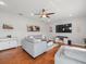 Relaxing living area with hardwood floors, recessed lighting, comfortable grey sofas, and a ceiling fan at 4805 Holdsworth Dr, Land O Lakes, FL 34639