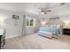 Large main bedroom with a king bed, ceiling fan, and natural light at 4805 Holdsworth Dr, Land O Lakes, FL 34639