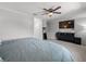 Cozy main bedroom with a king size bed, ceiling fan, walk in closet, and dresser at 4805 Holdsworth Dr, Land O Lakes, FL 34639