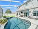Private pool area with a spa, lounge chairs, and outdoor television at 4805 Holdsworth Dr, Land O Lakes, FL 34639