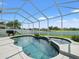 Resort-style pool and spa with a screened lanai and scenic views at 4805 Holdsworth Dr, Land O Lakes, FL 34639