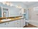 Bathroom features a double vanity with granite countertops and a shower/tub combo at 501 Knights Run Ave # 5103, Tampa, FL 33602