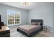 Bright bedroom with large window and modern light fixture at 501 Knights Run Ave # 5103, Tampa, FL 33602