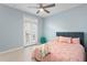 Airy bedroom with private balcony, ceiling fan and comfortable bed at 501 Knights Run Ave # 5103, Tampa, FL 33602