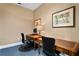 Well-lit business center with wooden desks, desk lamps, and comfortable chairs for productive work at 501 Knights Run Ave # 5103, Tampa, FL 33602
