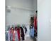 Walk-in closet with ample storage space and multiple hanging rods for organized storage at 501 Knights Run Ave # 5103, Tampa, FL 33602