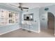 Bright dining area features a ceiling fan, breakfast bar and stairs leading to another floor at 501 Knights Run Ave # 5103, Tampa, FL 33602