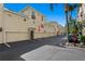 The exterior view highlights the property's access to personal parking spaces, including garages at 501 Knights Run Ave # 5103, Tampa, FL 33602