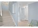 Light-filled hallway featuring modern lighting and light colored floors at 501 Knights Run Ave # 5103, Tampa, FL 33602