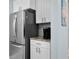 Updated kitchen with stainless steel refrigerator, granite countertops and white cabinetry at 501 Knights Run Ave # 5103, Tampa, FL 33602