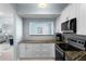 Open kitchen with granite countertops, stainless steel appliances, and views into the living room at 501 Knights Run Ave # 5103, Tampa, FL 33602