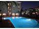 Nighttime view of a sparkling pool in a community setting with architectural lighting at 501 Knights Run Ave # 5103, Tampa, FL 33602