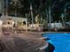 Sparkling pool featuring a brick paver deck, lounge chairs, and lush tropical landscaping at 501 Knights Run Ave # 5103, Tampa, FL 33602