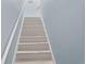 Staircase painted with complementary colors and new white treads at 501 Knights Run Ave # 5103, Tampa, FL 33602