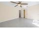 A simple bedroom with lots of natural light, ceiling fan and two doors to the hall and bathroom at 5010 109Th N Way, St Petersburg, FL 33708