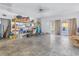 Spacious bonus room with shelves and outdoor access, ideal for storage or a workshop at 5010 109Th N Way, St Petersburg, FL 33708