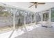 The Florida room features louvered glass windows, ceramic tile floor, and access to the backyard at 5010 109Th N Way, St Petersburg, FL 33708