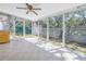 The Florida room features louvered glass windows, ceramic tile floor, and access to the backyard at 5010 109Th N Way, St Petersburg, FL 33708