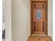 A solid wood front door with glass details, providing an inviting entrance to the home at 5010 109Th N Way, St Petersburg, FL 33708