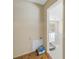 Hallway with access to the living room and a pet bed in the corner. Tile flooring at 5010 109Th N Way, St Petersburg, FL 33708