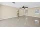A spacious living room with tile floors and neutral walls, ideal for relaxing and entertaining at 5010 109Th N Way, St Petersburg, FL 33708