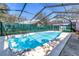 Relaxing screened-in pool area, perfect for enjoying a refreshing swim on a hot summer day at 5010 109Th N Way, St Petersburg, FL 33708