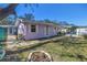 Exterior of the house shows a fire pit and a chain link fence surrounding the property at 5010 109Th N Way, St Petersburg, FL 33708