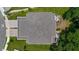 An aerial view highlights the backyard patio and landscaping features of this well-maintained home at 5332 Riverwalk Preserve Dr, New Port Richey, FL 34653