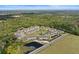 Panoramic aerial view of townhome community surrounded by lush green forest and landscaping at 5332 Riverwalk Preserve Dr, New Port Richey, FL 34653