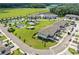 Aerial view of a new construction community with ponds, pool and landscaping at 5332 Riverwalk Preserve Dr, New Port Richey, FL 34653
