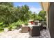 Enjoy outdoor living on this paver patio, complete with comfortable seating and lush landscaping at 5332 Riverwalk Preserve Dr, New Port Richey, FL 34653