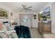 Bright bedroom with light decor, ceiling fan, and TV at 5332 Riverwalk Preserve Dr, New Port Richey, FL 34653