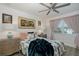 Bright bedroom featuring soft decor, a ceiling fan, and a comfortable bed at 5332 Riverwalk Preserve Dr, New Port Richey, FL 34653