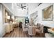 Elegant dining area with soaring ceilings, modern light fixture, and stylish furnishings at 5332 Riverwalk Preserve Dr, New Port Richey, FL 34653