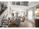Stylish dining area featuring modern decor, hardwood floors, and elegant furnishings at 5332 Riverwalk Preserve Dr, New Port Richey, FL 34653