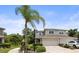 Charming home featuring a two-car garage, beautiful landscaping, a well-manicured lawn, and a welcoming front entrance at 5332 Riverwalk Preserve Dr, New Port Richey, FL 34653