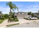 Spacious two-story home with a two-car garage, neat landscaping, and ample parking space on a sunny day at 5332 Riverwalk Preserve Dr, New Port Richey, FL 34653