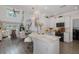 Open-concept kitchen with marble countertops, sleek appliances, and seamless flow to dining and living areas at 5332 Riverwalk Preserve Dr, New Port Richey, FL 34653