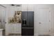 The kitchen includes a modern stainless steel refrigerator and plenty of storage and counter space at 5332 Riverwalk Preserve Dr, New Port Richey, FL 34653