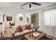 Cozy living room with plush sofa, decor, and large window with natural light at 5332 Riverwalk Preserve Dr, New Port Richey, FL 34653