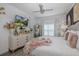 Comfortable main bedroom features ample natural light, decorative furnishings, and a serene ambiance at 5332 Riverwalk Preserve Dr, New Port Richey, FL 34653