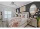 Serene main bedroom showcasing a luxurious bed, decorative accents, and plenty of natural light at 5332 Riverwalk Preserve Dr, New Port Richey, FL 34653