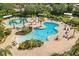 Expansive aerial shot showcasing the community pool area with multiple pools and relaxing seating options at 5646 Sunset Falls Dr, Apollo Beach, FL 33572