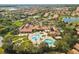 Expansive aerial view showcasing community amenities, including pools, landscaping, and residential homes at 5646 Sunset Falls Dr, Apollo Beach, FL 33572