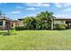 Spacious green backyard with lush plants at 5646 Sunset Falls Dr, Apollo Beach, FL 33572