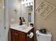 Nicely appointed half-bathroom with a dark wood vanity and decorative accents at 5646 Sunset Falls Dr, Apollo Beach, FL 33572