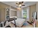 Bright bedroom with a Murphy bed, ceiling fan, and a convenient treadmill at 5646 Sunset Falls Dr, Apollo Beach, FL 33572
